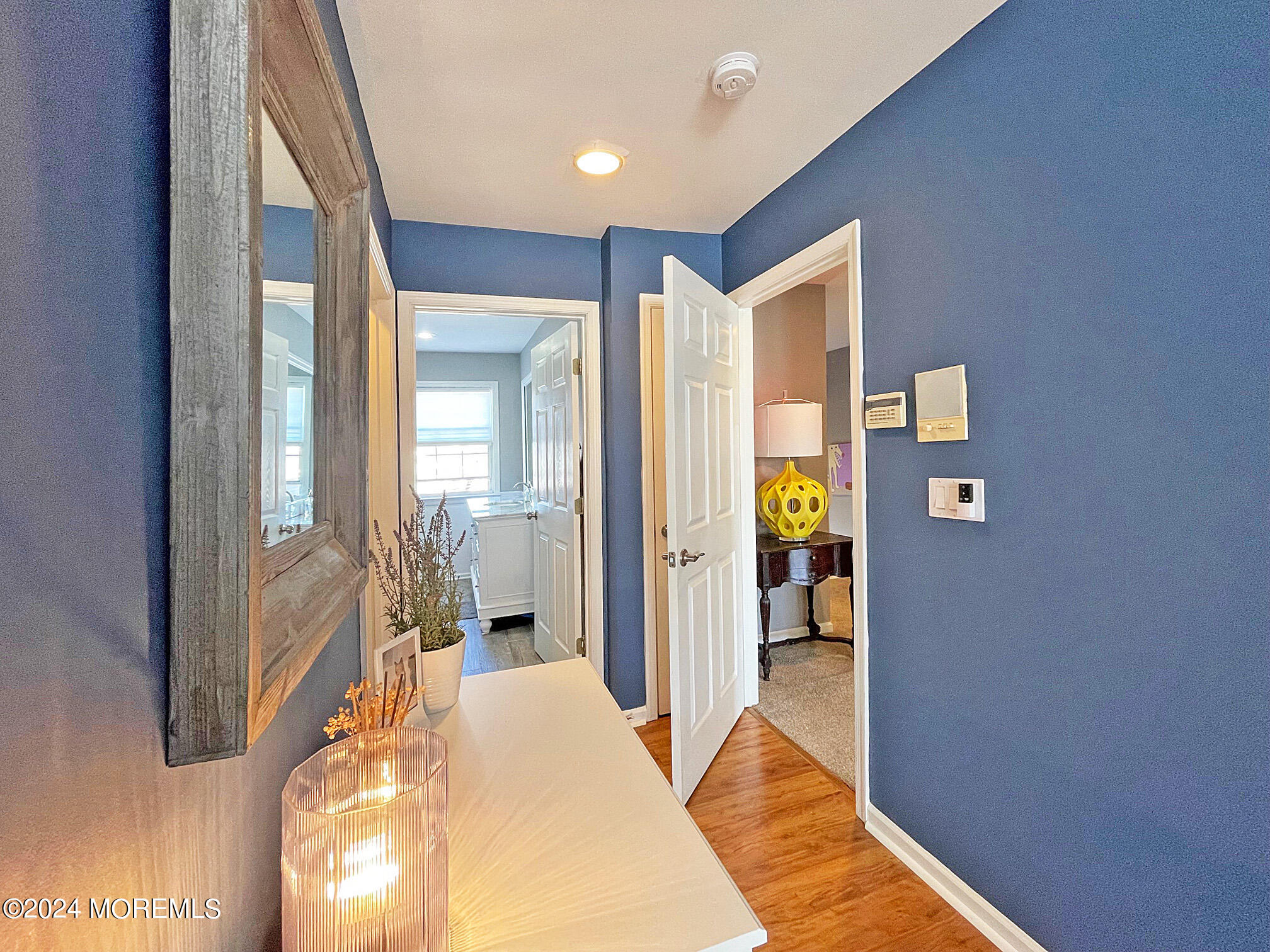 139 3rd Street, Unit 2 Keyport, NJ 07735 - Photo 18 of 36 a bedroom with a bed and a chandelier