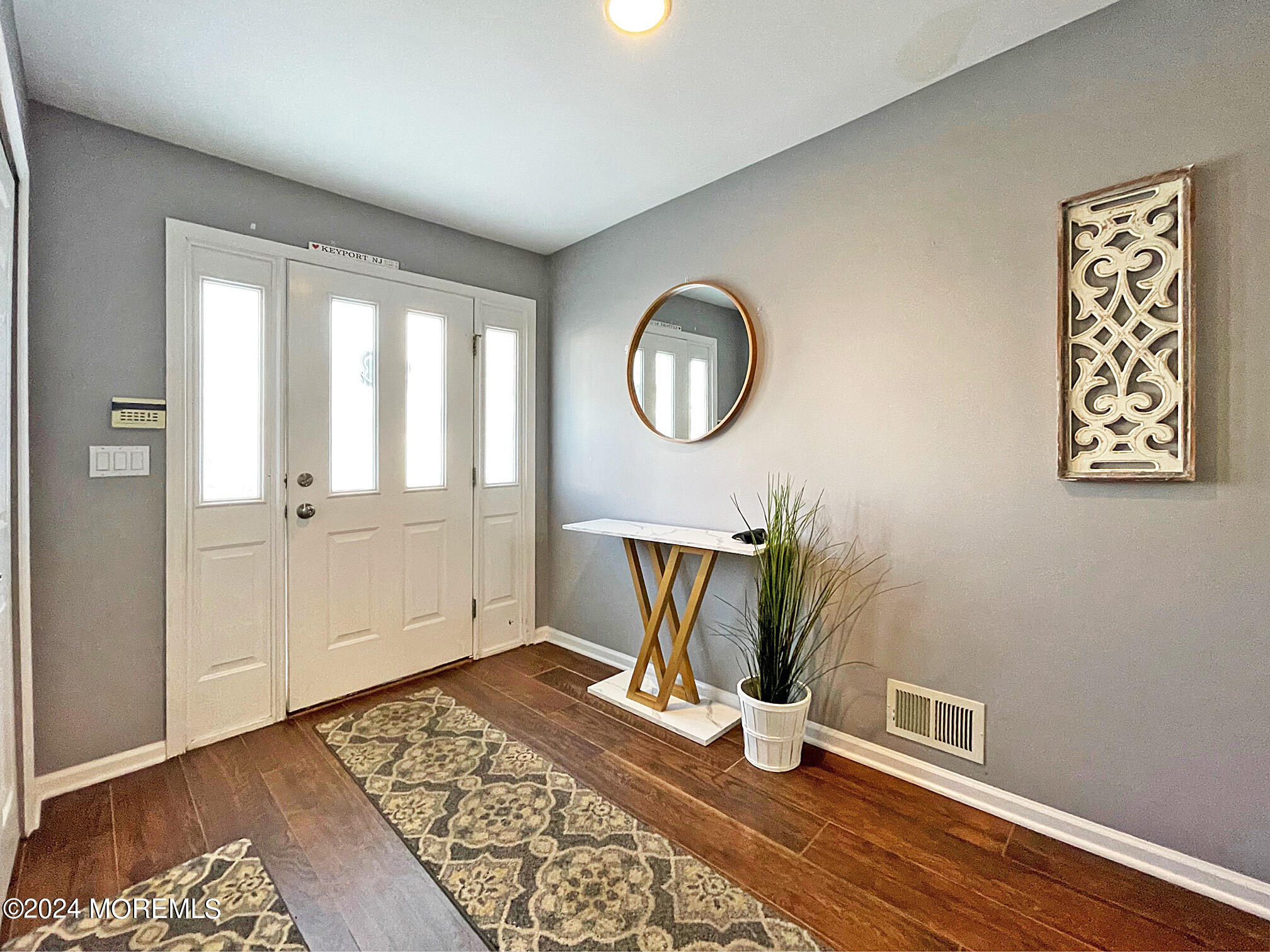 139 3rd Street, Unit 2 Keyport, NJ 07735 - Photo 2 of 36 a view of an empty room with wooden floor and a window