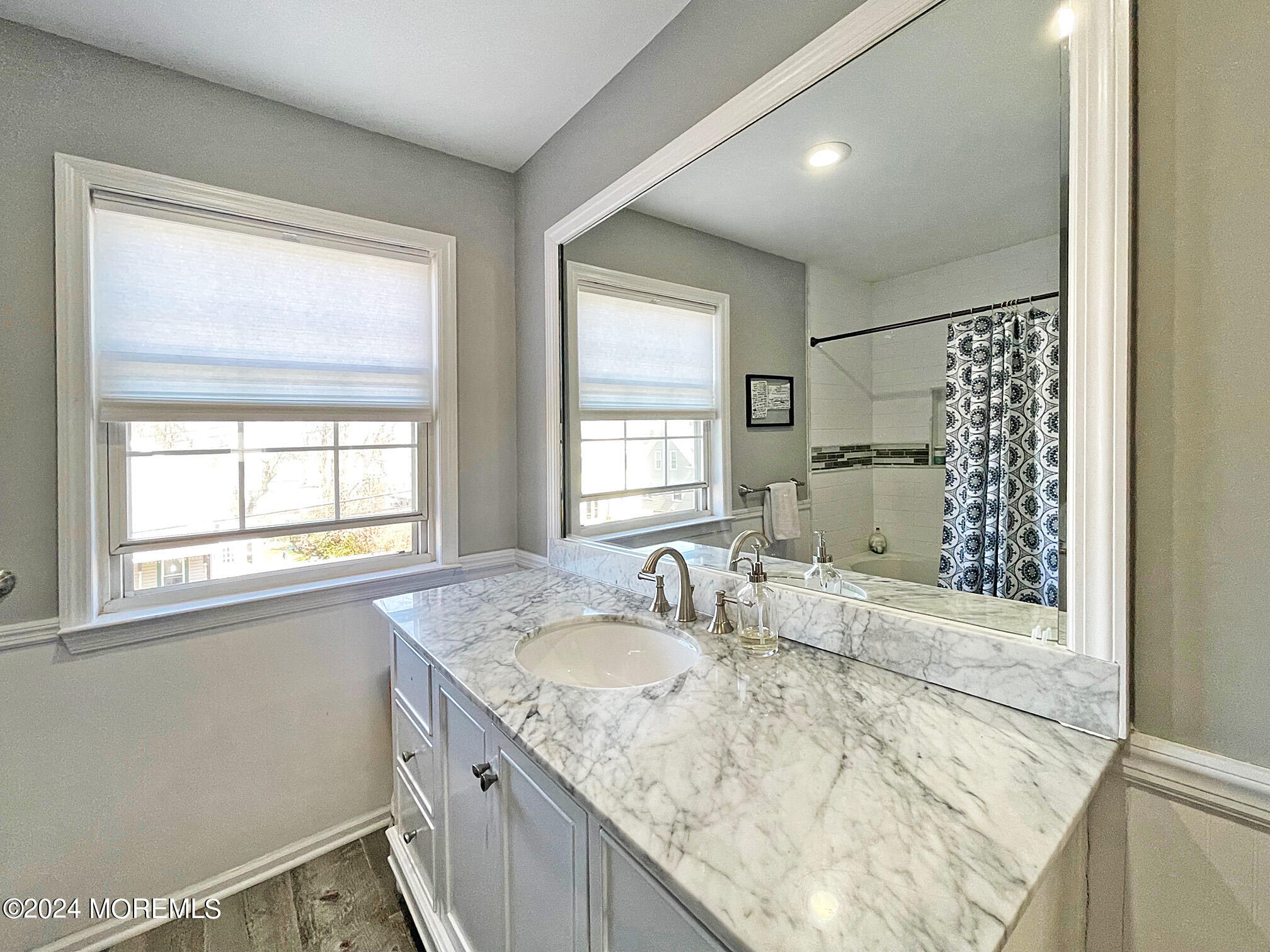 139 3rd Street, Unit 2 Keyport, NJ 07735 - Photo 21 of 36 a bathroom with a granite countertop sink a mirror and a shower