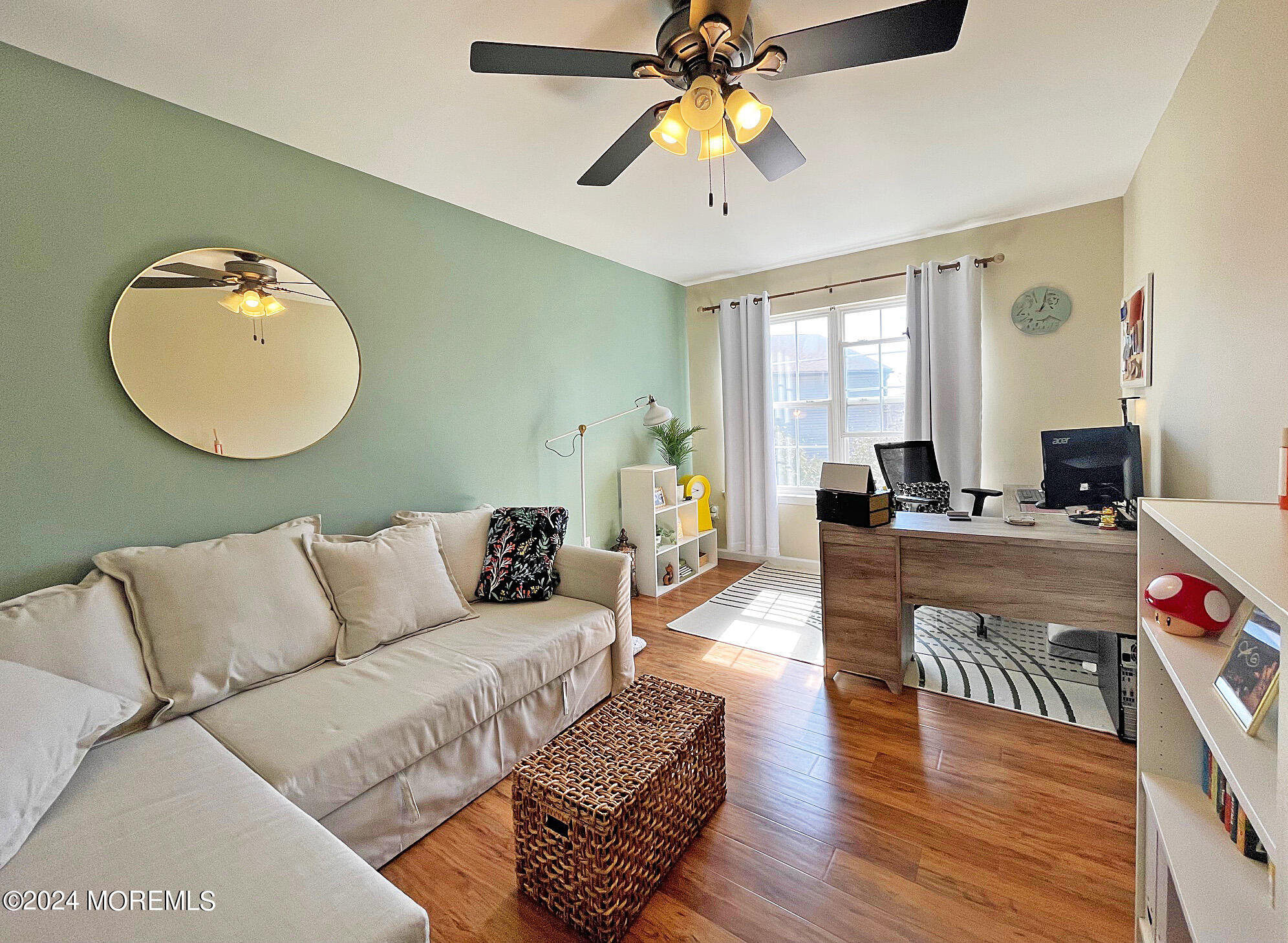 139 3rd Street, Unit 2 Keyport, NJ 07735 - Photo 23 of 36 a living room with furniture a flat screen tv and a large window