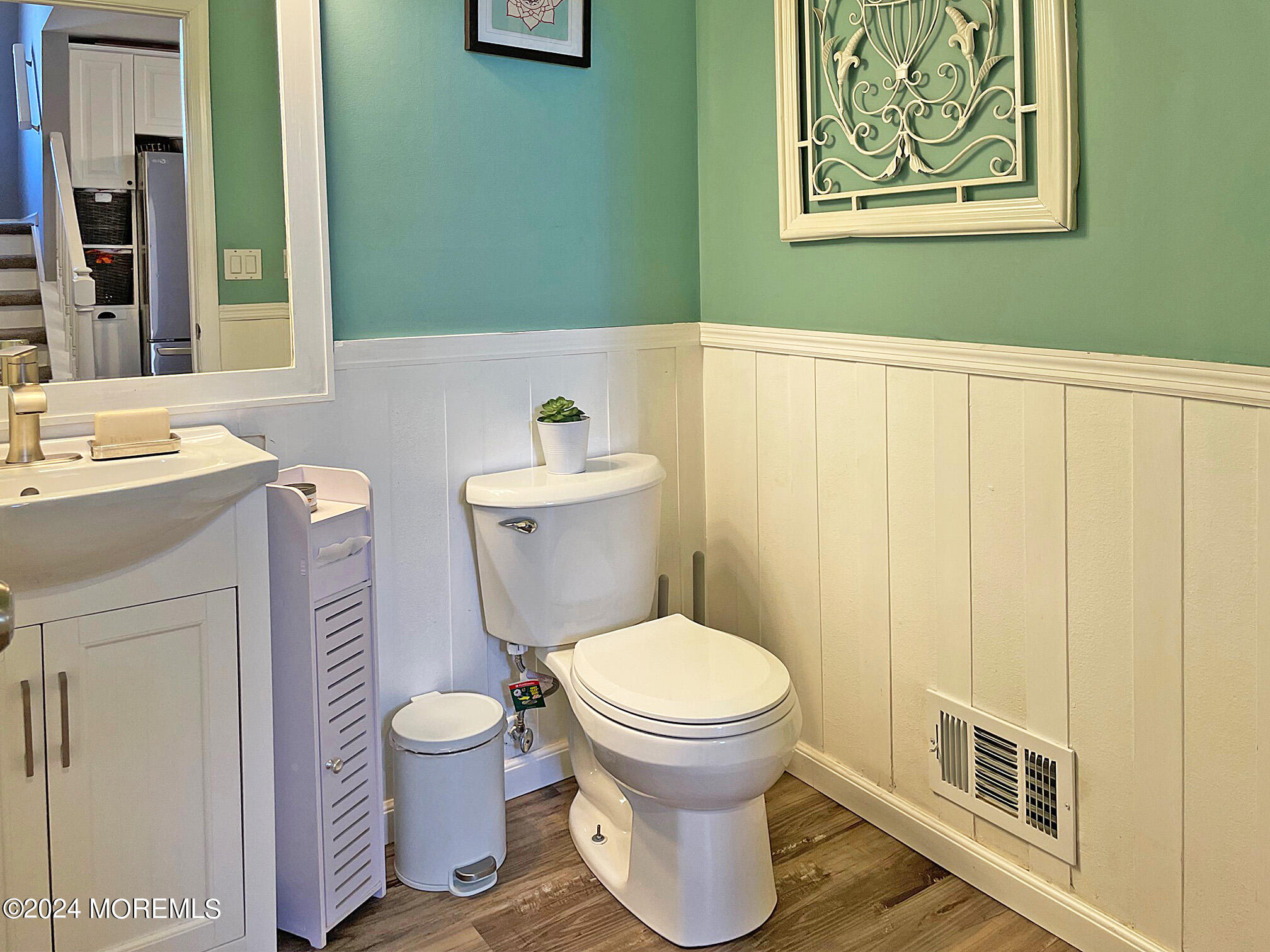 139 3rd Street, Unit 2 Keyport, NJ 07735 - Photo 24 of 36 a bathroom with a toilet sink and mirror