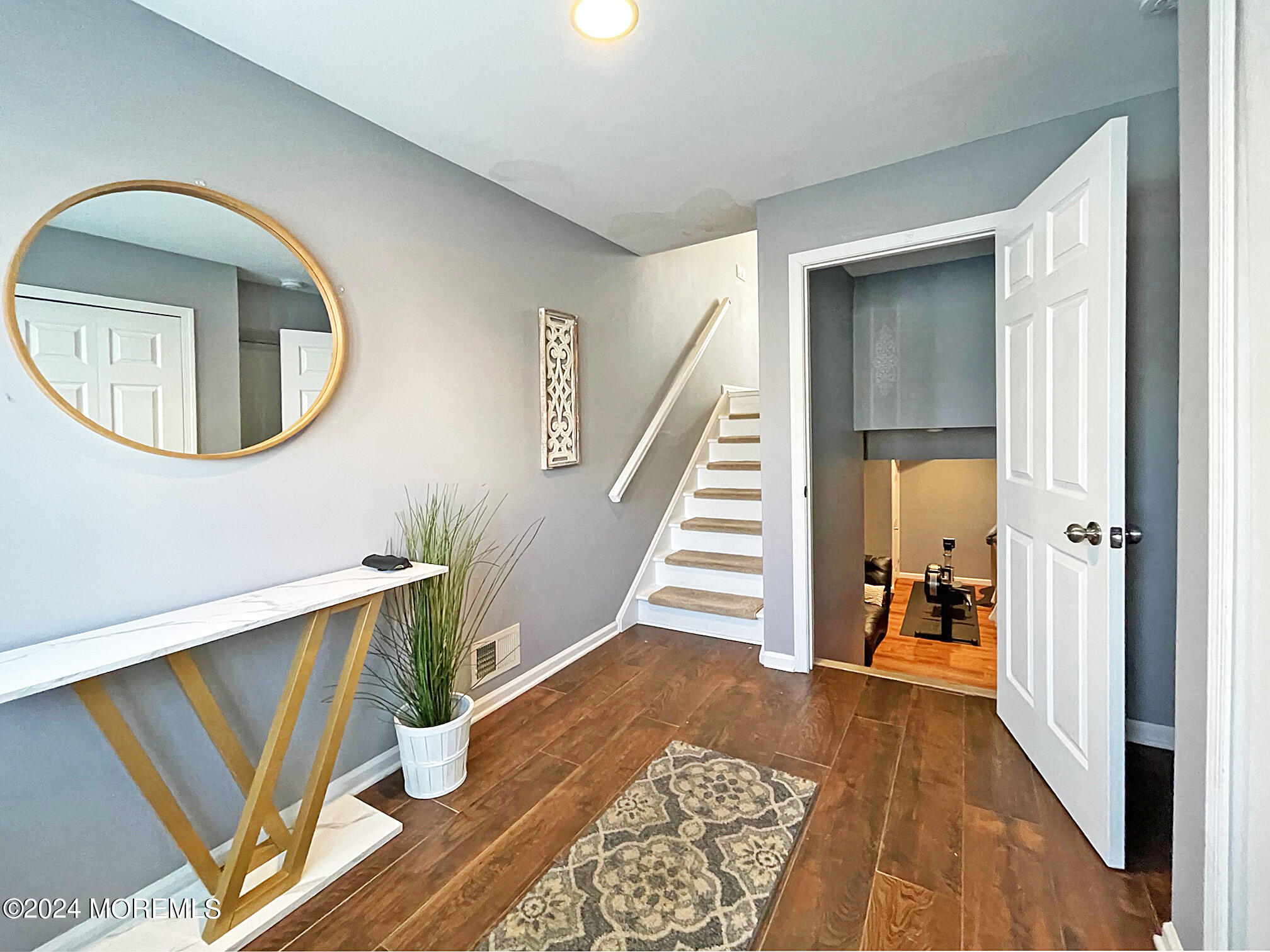 139 3rd Street, Unit 2 Keyport, NJ 07735 - Photo 29 of 36 a view of a hallway with wooden floor and staircase