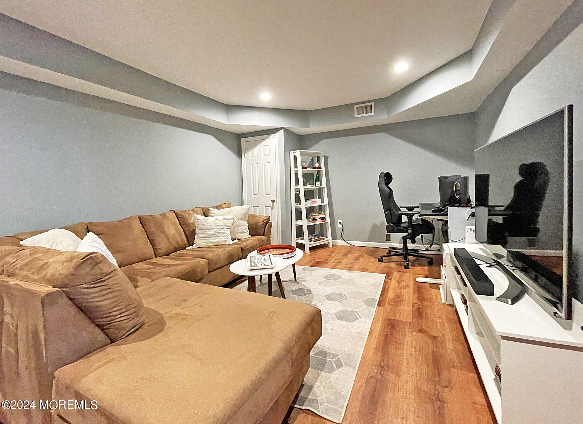 139 3rd Street, Unit 2 Keyport, NJ 07735 - Photo 30 of 36 a living room with furniture and a flat screen tv