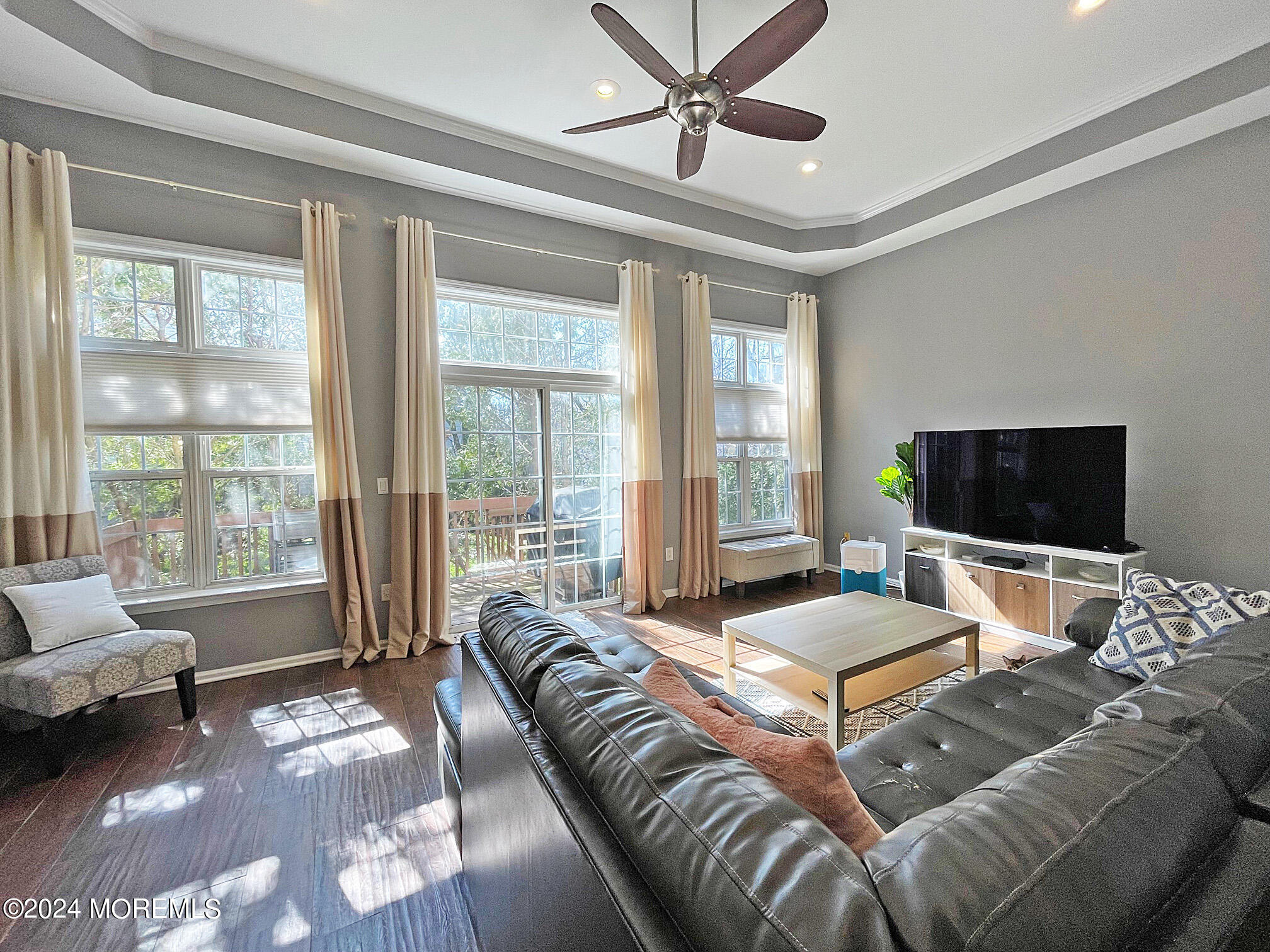 139 3rd Street, Unit 2 Keyport, NJ 07735 - Photo 3 of 36 a bedroom with furniture and a flat screen tv