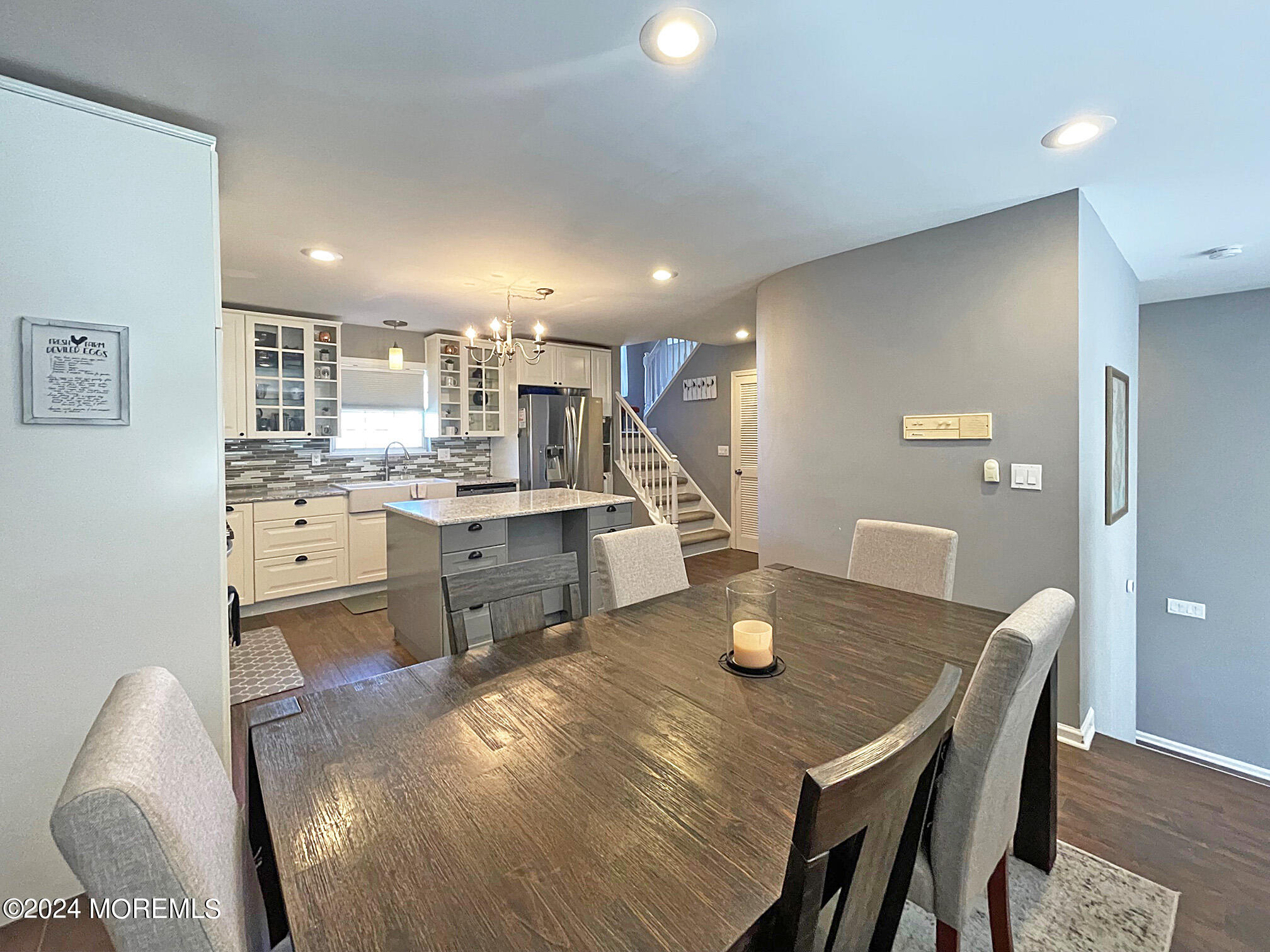 139 3rd Street, Unit 2 Keyport, NJ 07735 - Photo 5 of 36 a kitchen with a table chairs and wooden floor