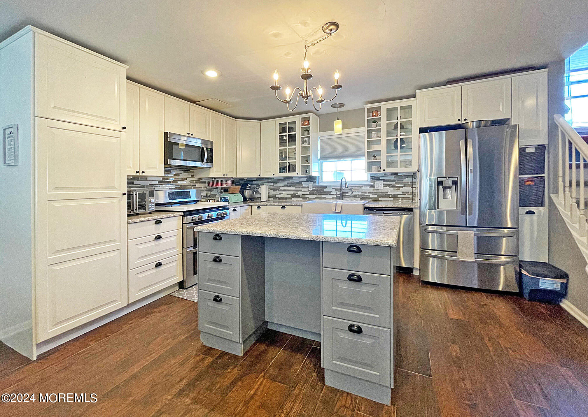 139 3rd Street, Unit 2 Keyport, NJ 07735 - Photo 8 of 36 a kitchen with stainless steel appliances a refrigerator sink and cabinets