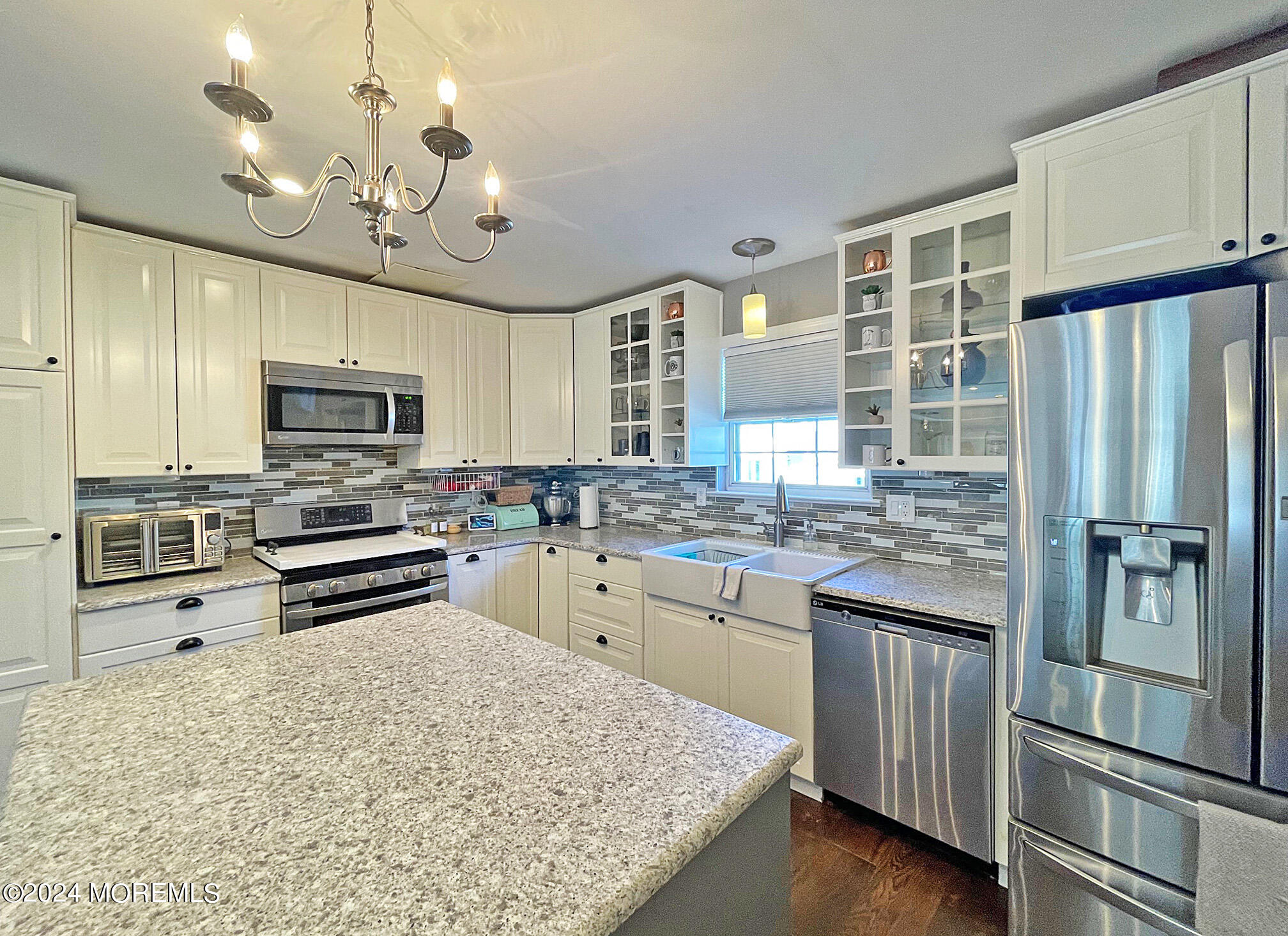 139 3rd Street, Unit 2 Keyport, NJ 07735 - Photo 9 of 36 a kitchen with stainless steel appliances granite countertop a stove refrigerator and microwave