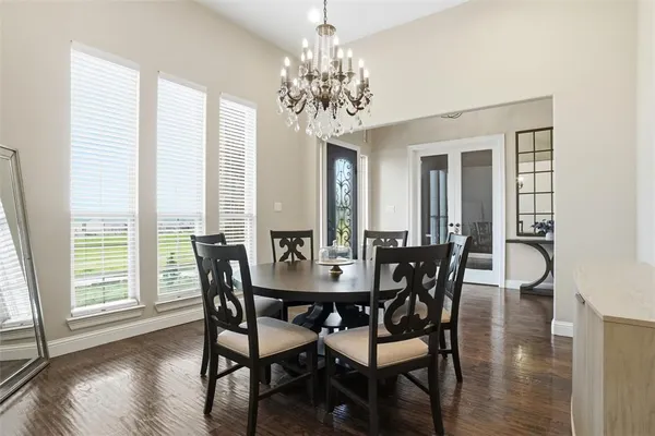 a view of a dining room with furniture and window