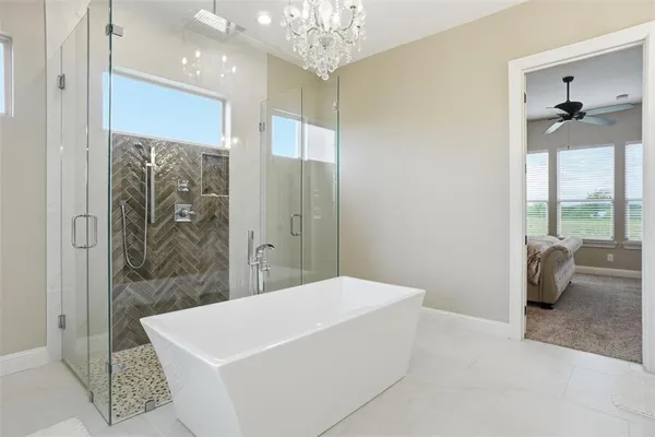 a spacious bathroom with a shower and a bathtub