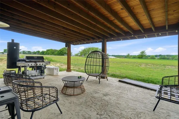 a view of yard with patio