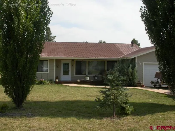 a kitchen with stainless steel appliances granite countertop a sink and a refrigerator