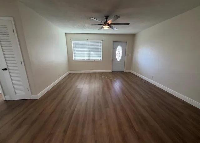 an empty room that has a window