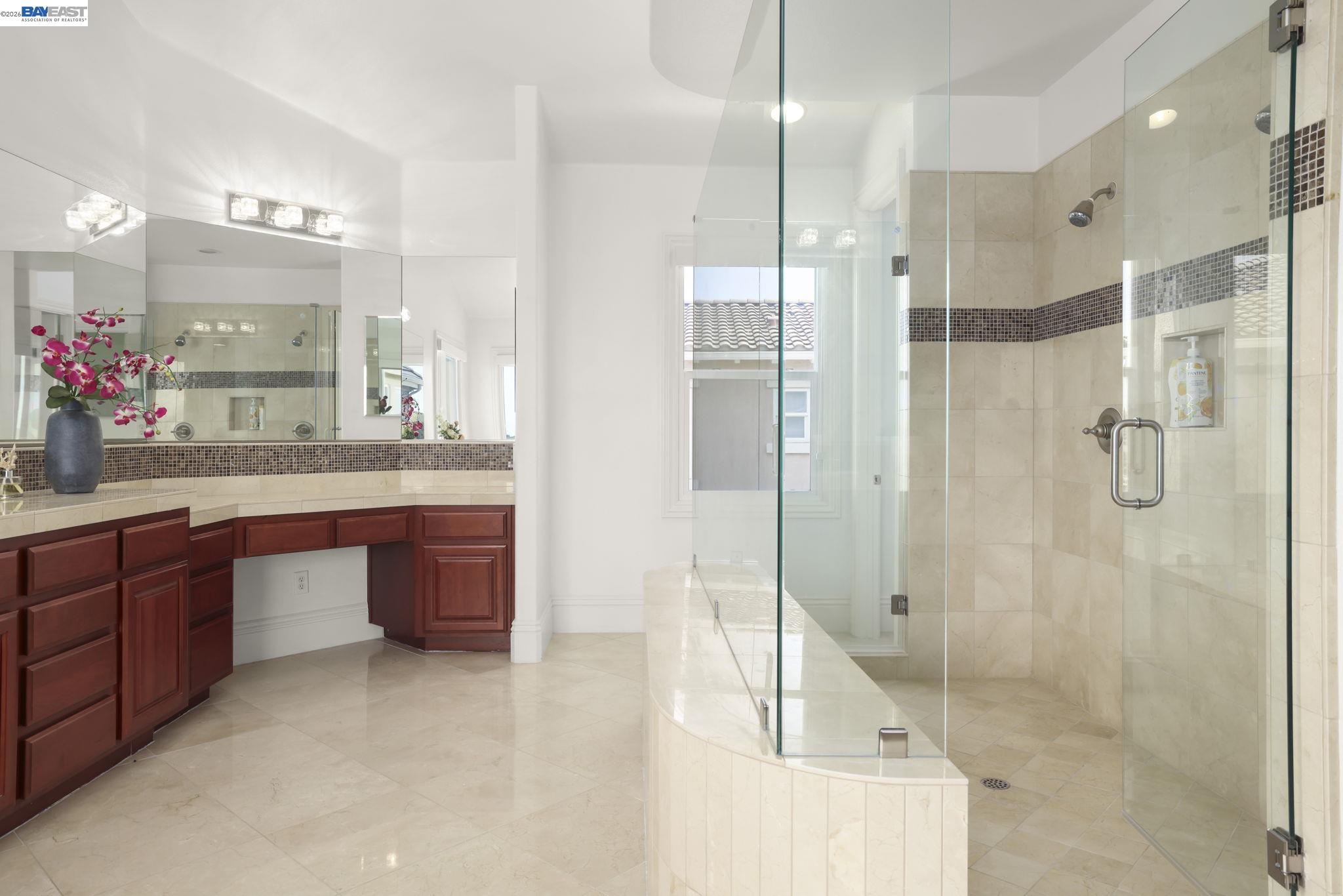 950 Winsford Court San Ramon, CA 94583 - Photo 40 of 68 a bathroom with a granite countertop sink mirror and shower