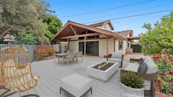 a view of a patio with a table and chairs