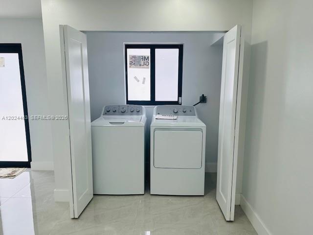 11870 Southwest 5th Street, Unit 1 Miami, FL 33184 - Photo 18 of 38 a utility room with dryer and washer