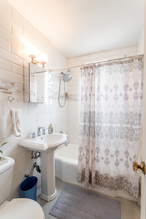 5614 Netherland Avenue, Unit 5C Bronx, NY 10471 - Photo 4 of 9 a bathroom with a sink toilet and shower