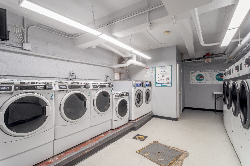 5614 Netherland Avenue, Unit 5C Bronx, NY 10471 - Photo 8 of 9 a utility room with dryer and washer