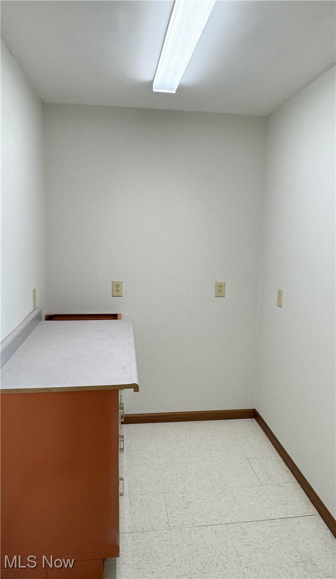 6255 Highland Ridge Road Lowell, OH 45744 - Photo 15 of 40 Empty room featuring light flooring and baseboards