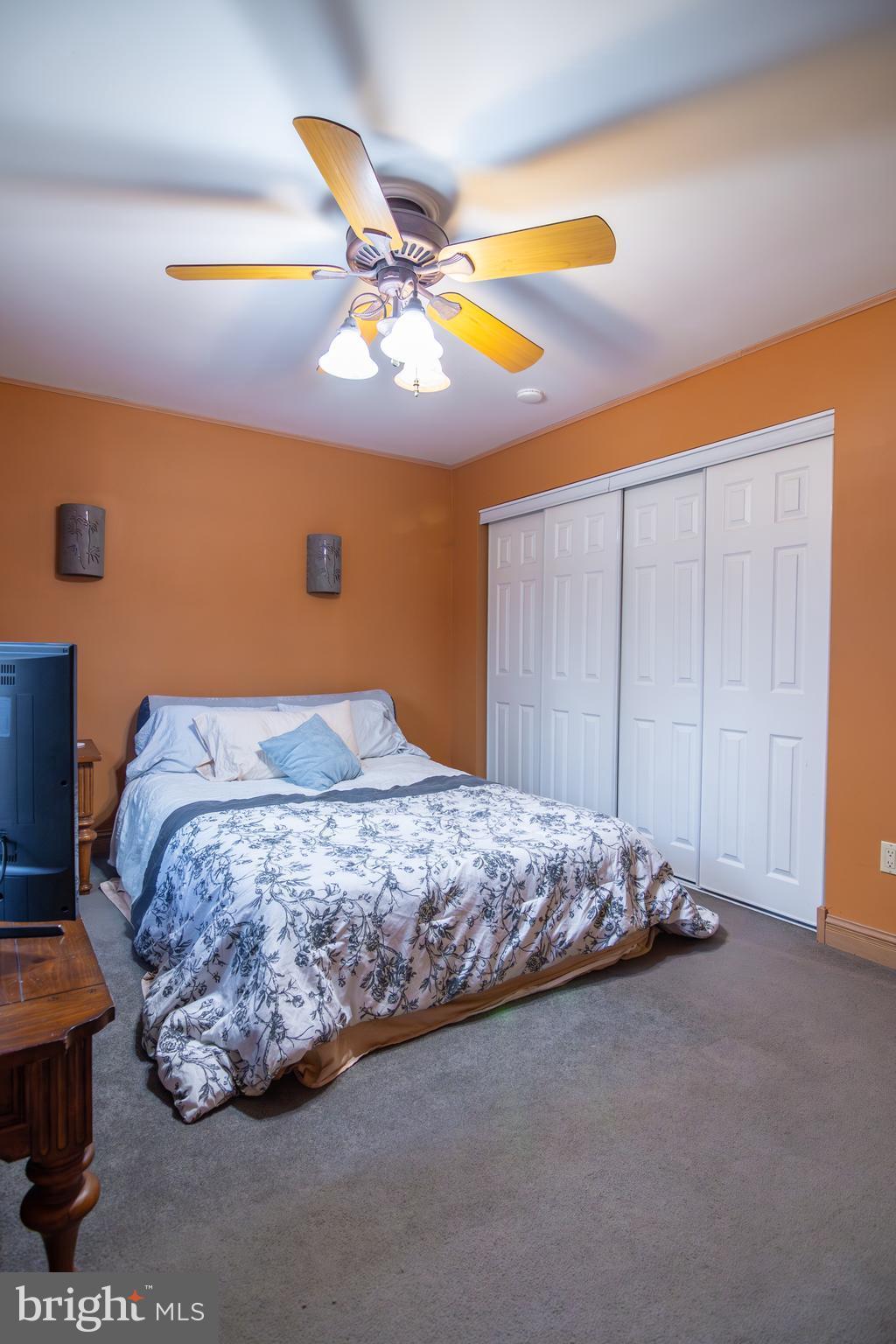 163 Rock Hill Church Road Stafford, VA 22556 - Photo 13 of 43 a bedroom with a bed and a painting on the wall