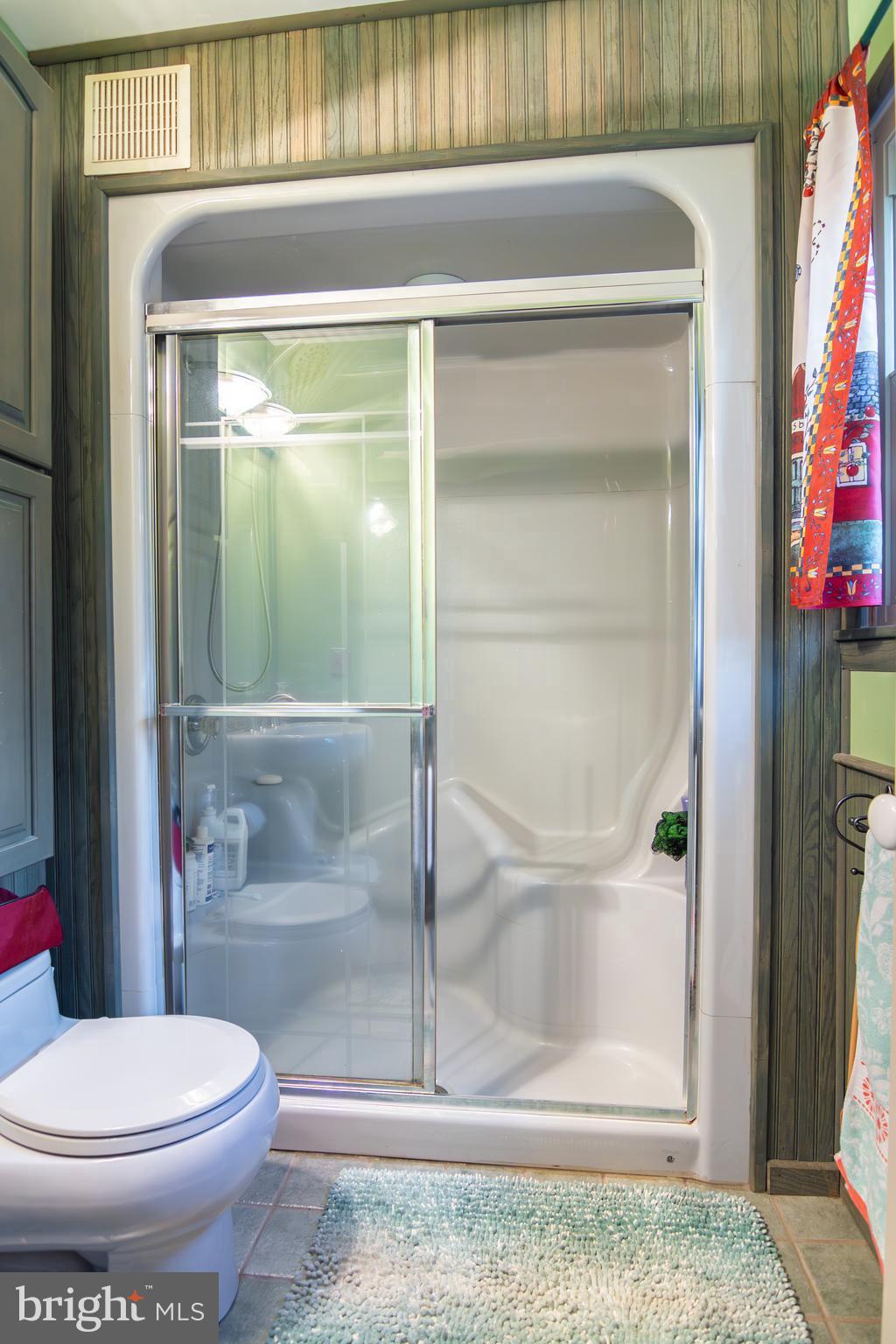 163 Rock Hill Church Road Stafford, VA 22556 - Photo 15 of 43 a bathroom with a toilet and a shower