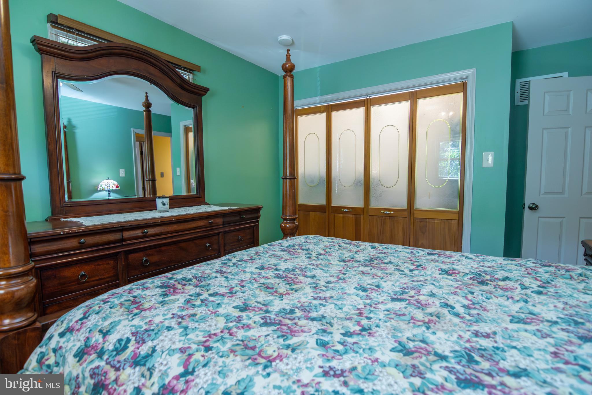 163 Rock Hill Church Road Stafford, VA 22556 - Photo 18 of 43 a bedroom with a bed and a large dresser