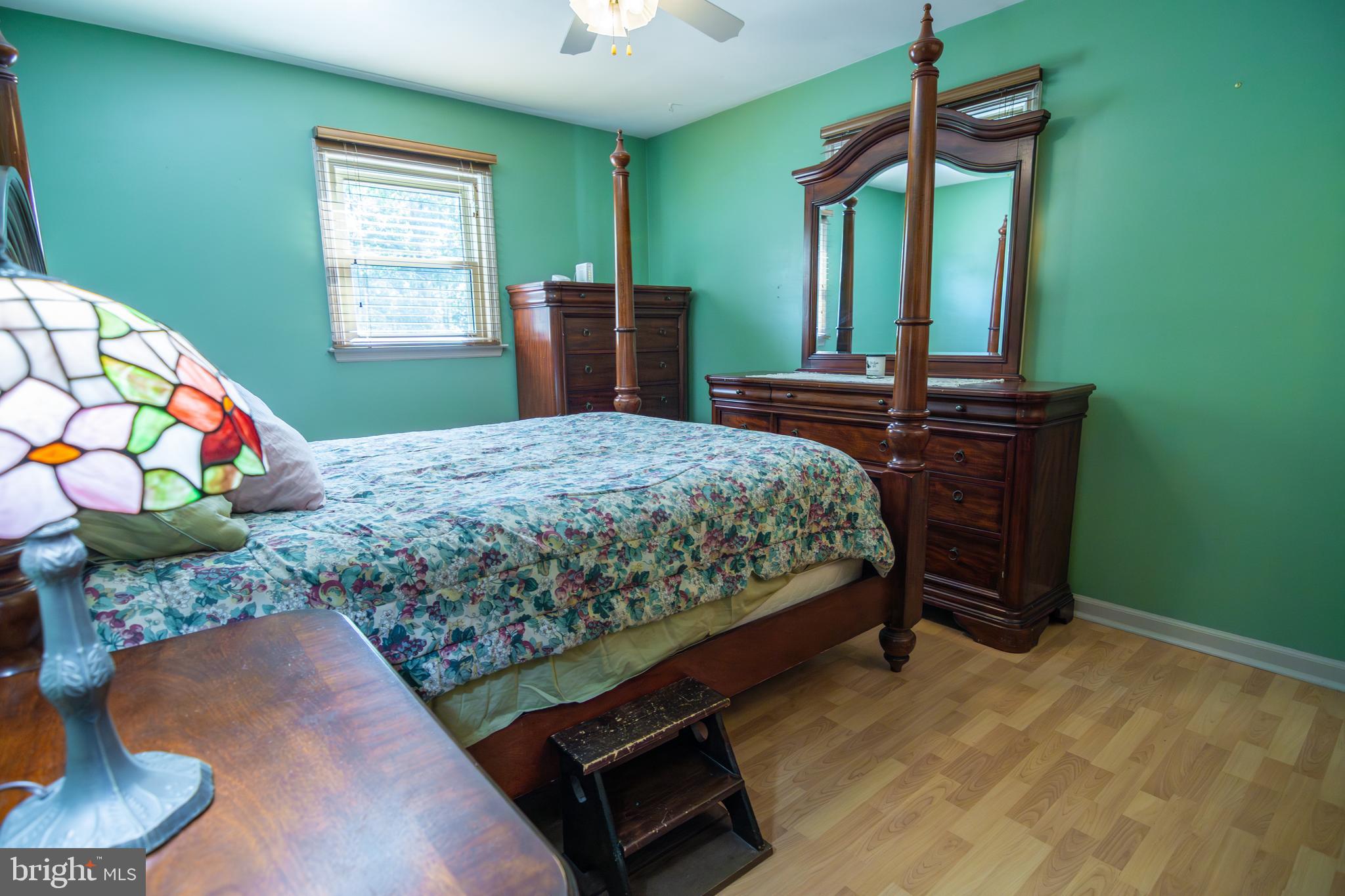 163 Rock Hill Church Road Stafford, VA 22556 - Photo 19 of 43 a bedroom with a bed window and dresser