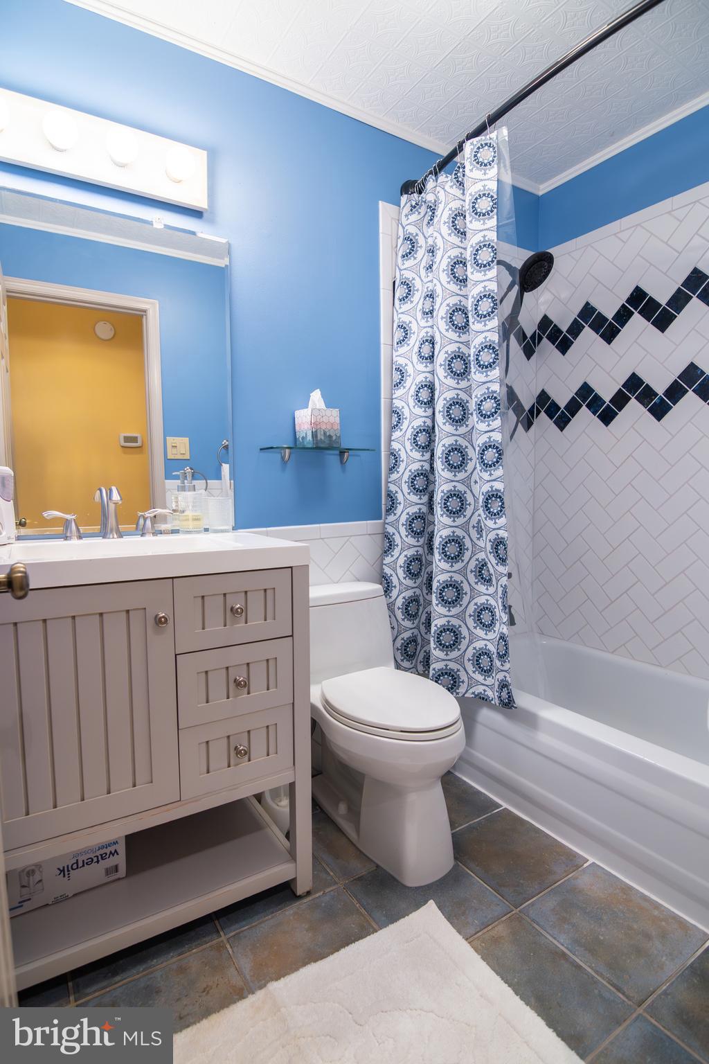 163 Rock Hill Church Road Stafford, VA 22556 - Photo 20 of 43 a bathroom with a sink a toilet and a mirror
