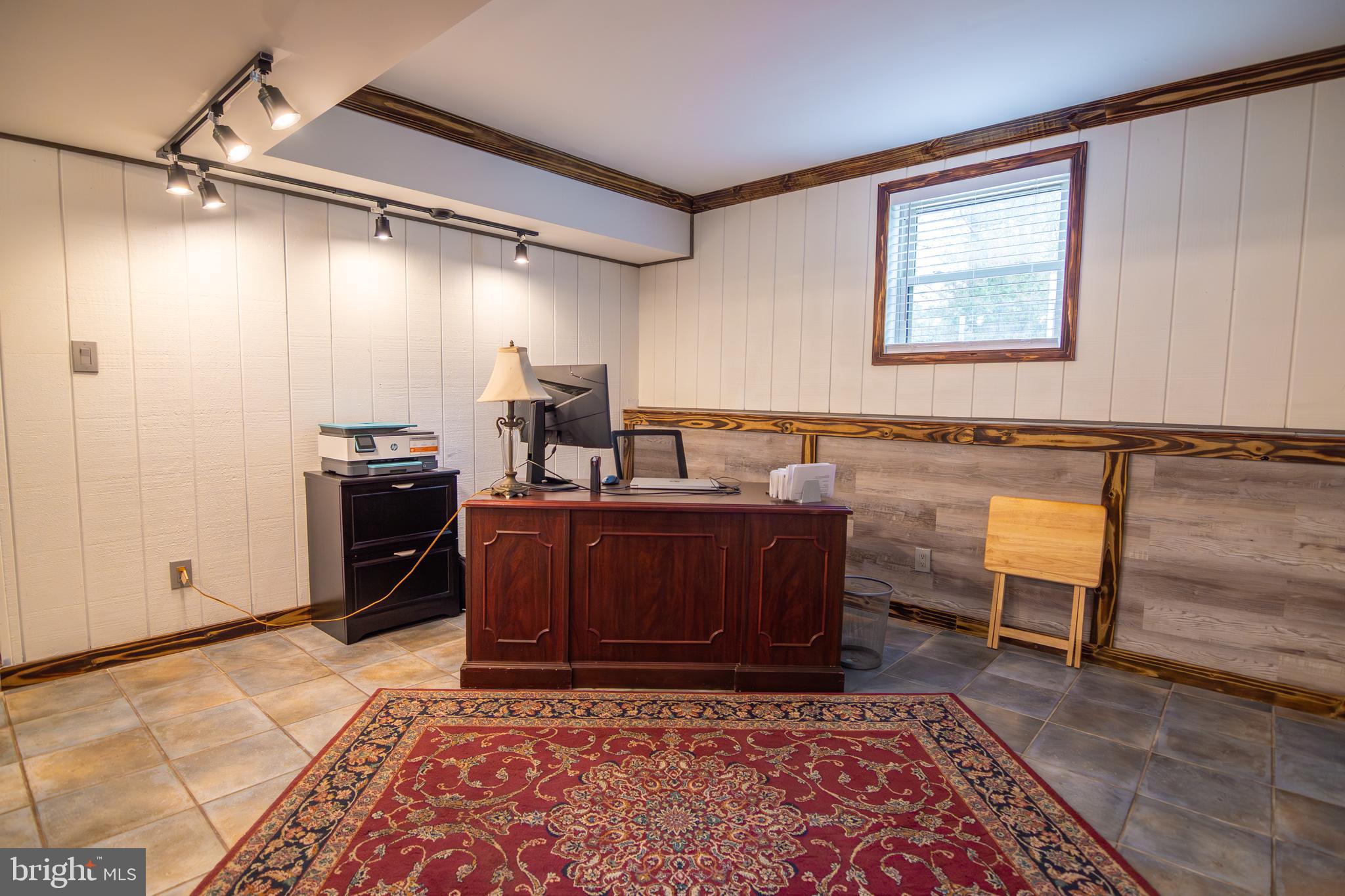 163 Rock Hill Church Road Stafford, VA 22556 - Photo 27 of 43 a living room with a couch and a dresser with wooden floor