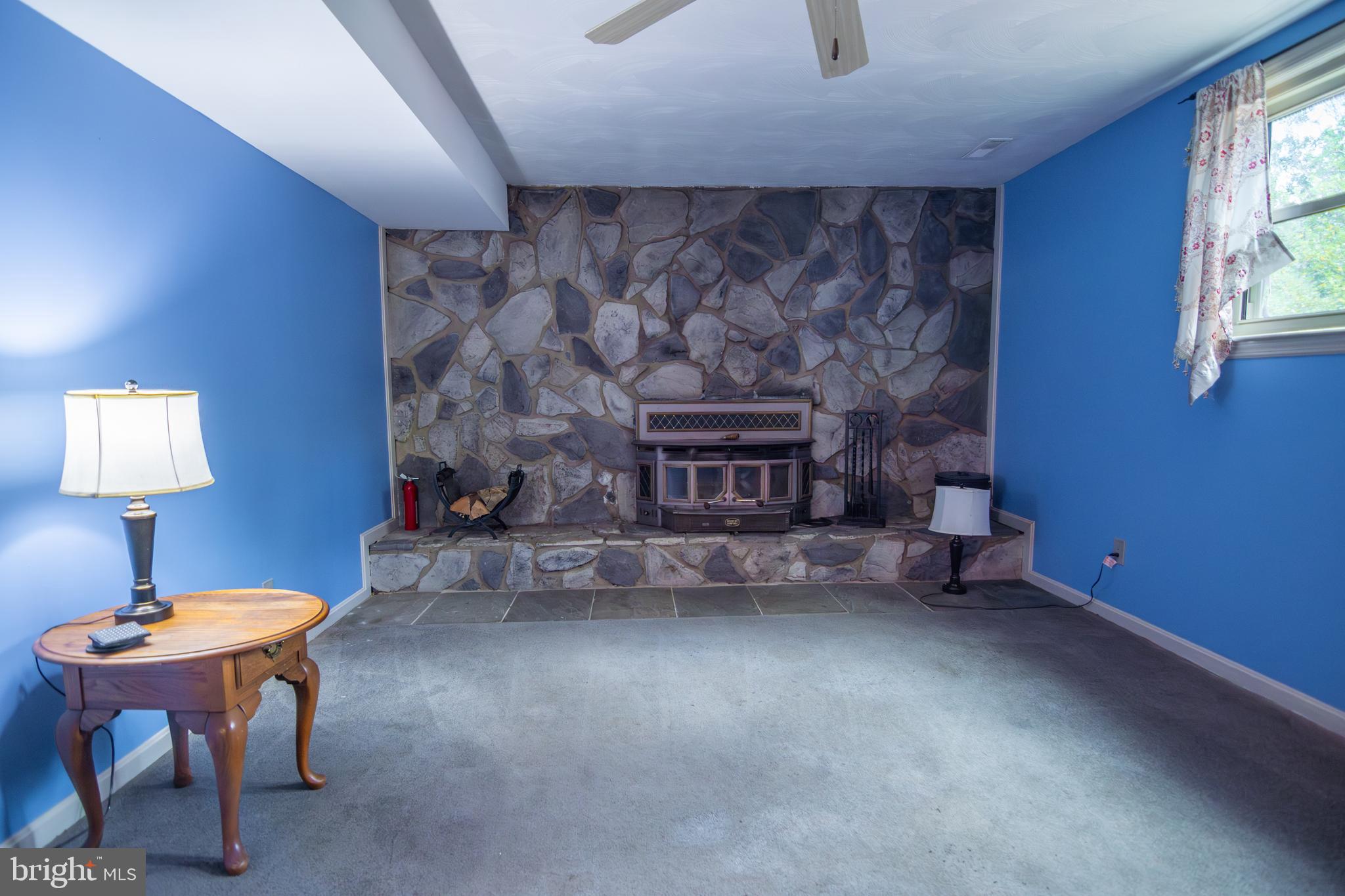 163 Rock Hill Church Road Stafford, VA 22556 - Photo 28 of 43 a living room with furniture and a fireplace