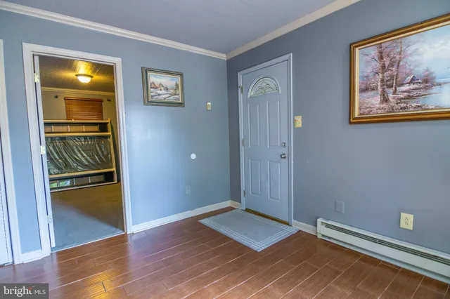 a view of room with window and wooden floor