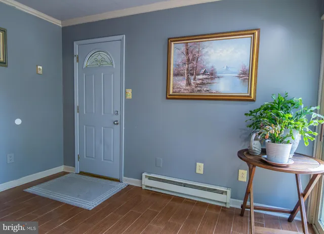 a workspace with furniture and a potted plant