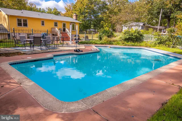 a view of a swimming pool with a patio