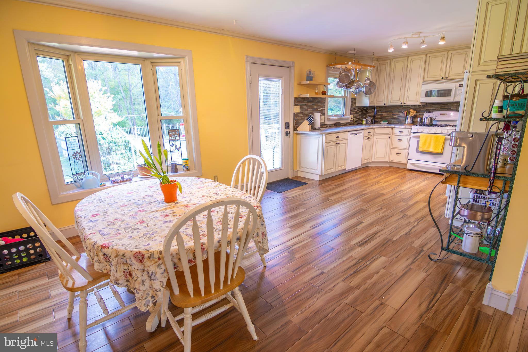 163 Rock Hill Church Road Stafford, VA 22556 - Photo 6 of 43 a dining room with furniture and wooden floor
