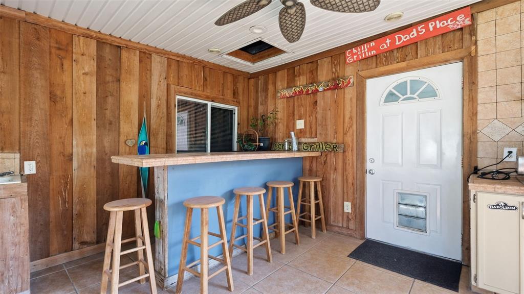 10565 Bessemer Street New Port Richey, FL 34654 - Photo 29 of 72 a view of kitchen with furniture and a window