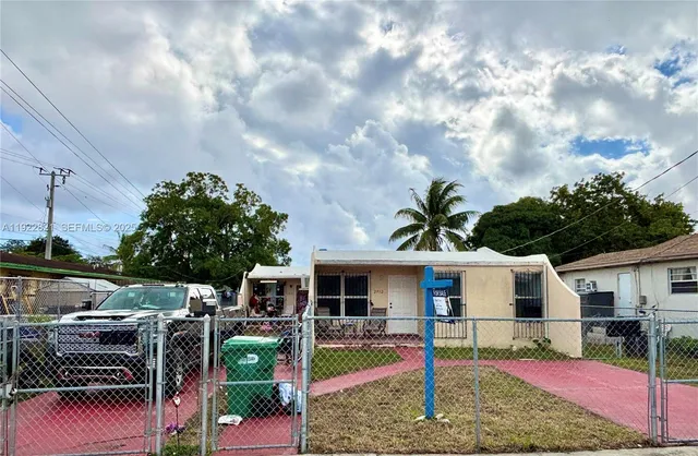 a front view of house with yard nad seating space