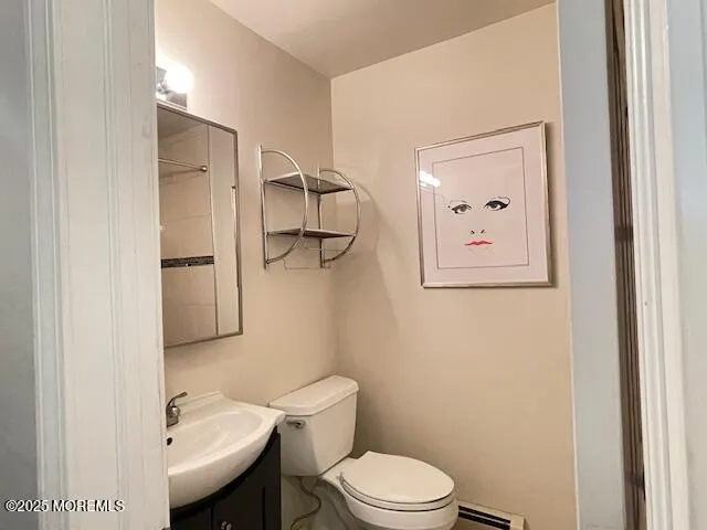 a white toilet sitting next to a bathroom sink