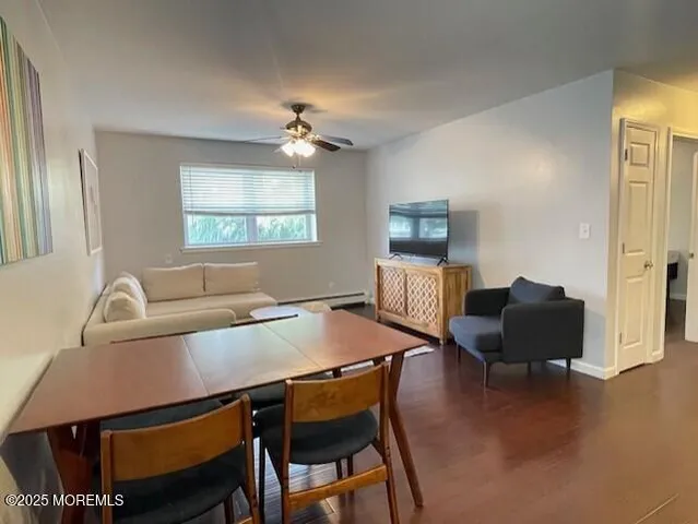 a view of a dining room with furniture and a window