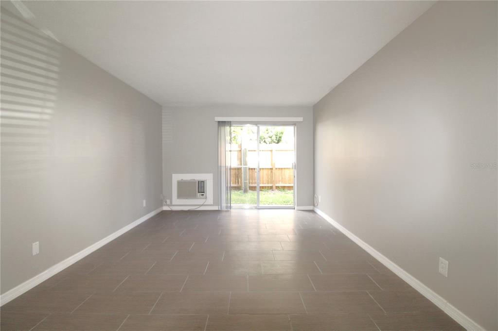 3001 Bee Ridge Road, Unit 121 Sarasota, FL 34239 - Photo 4 of 19 a view of an empty room with a window