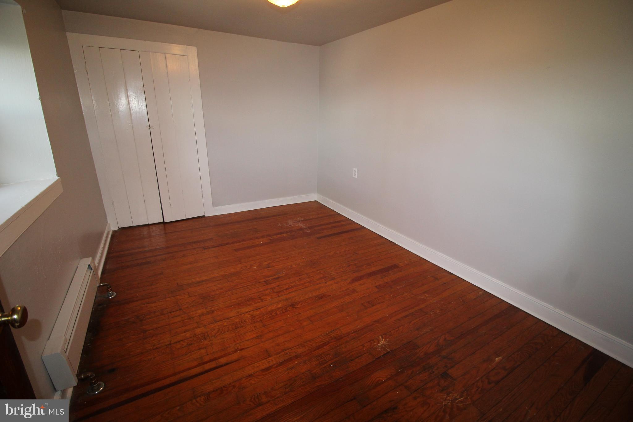 1074 Georgetown Road Paradise, PA 17562 - Photo 4 of 7 a view of empty room with wooden floor
