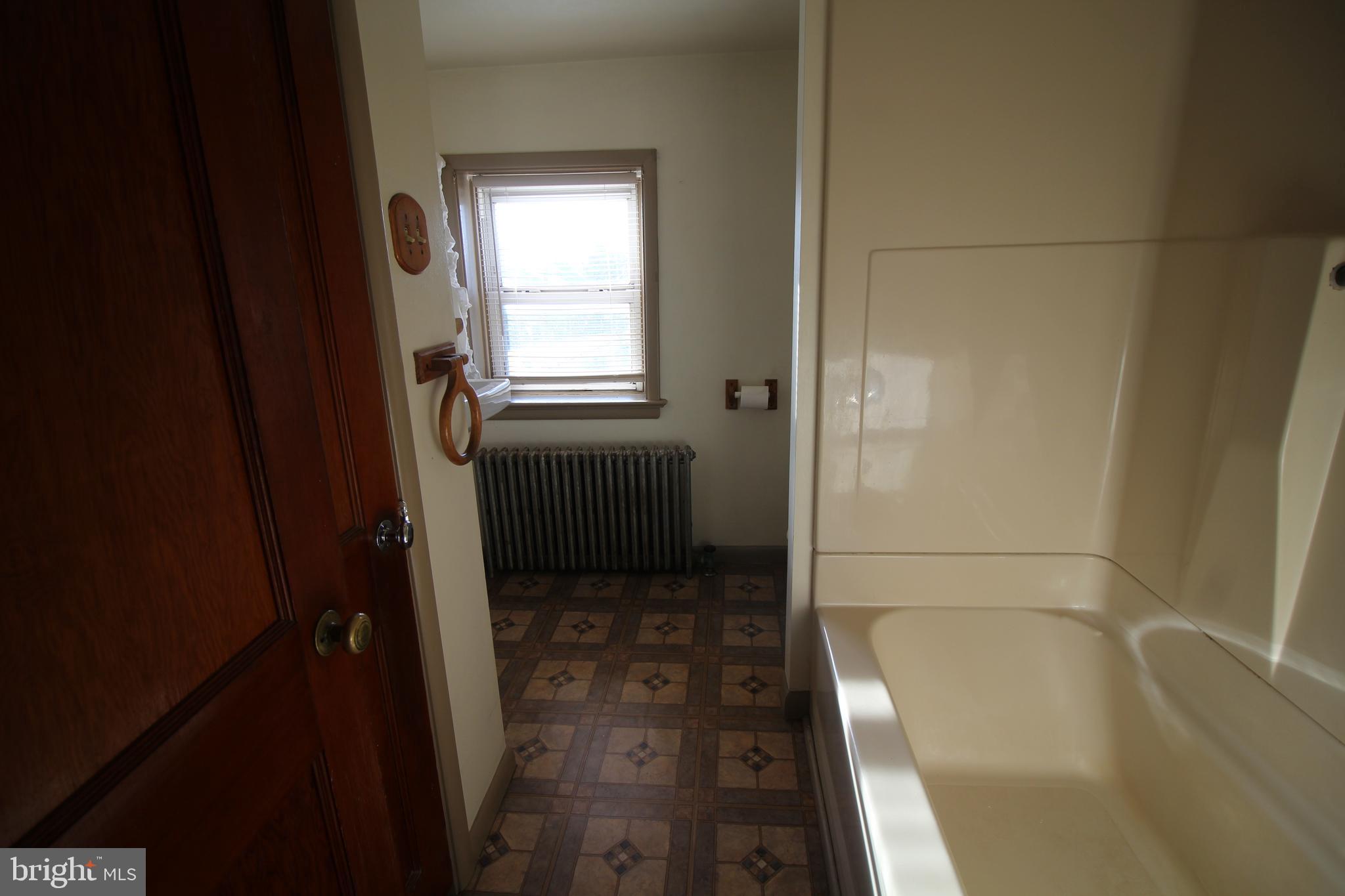 1074 Georgetown Road Paradise, PA 17562 - Photo 7 of 7 a bathroom with a tub and shower