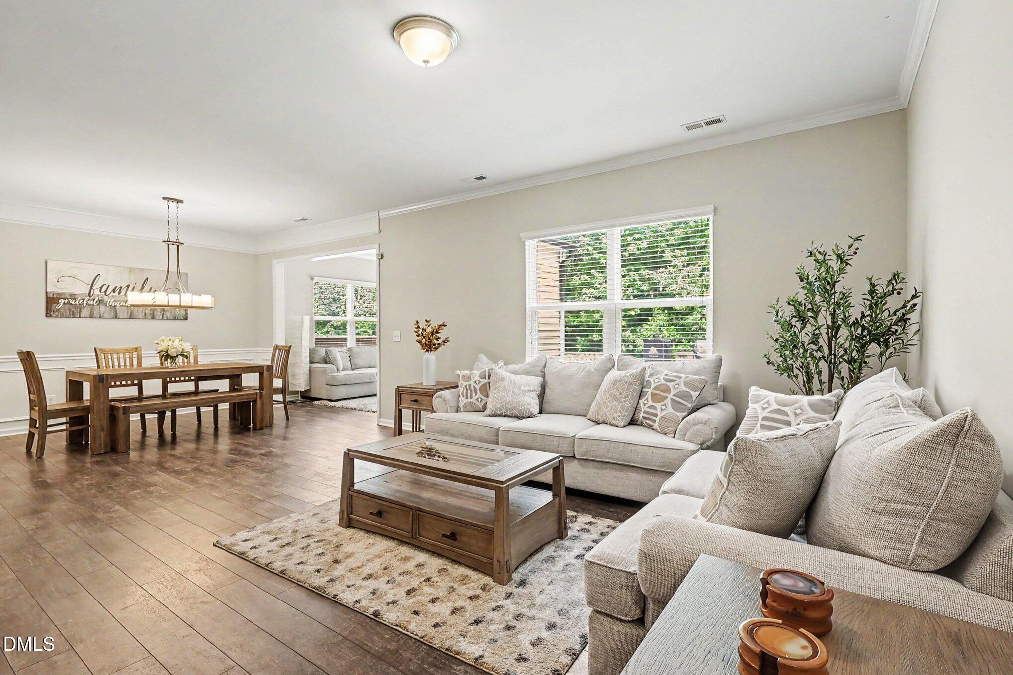 4366 Auburn Hills Drive Raleigh, NC 27616 - Photo 6 of 40 a living room with furniture and a large window