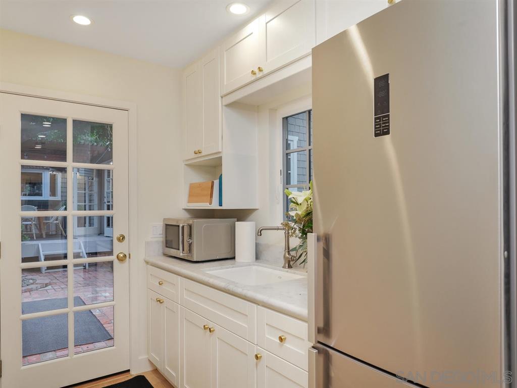 253 26th Street Del Mar, CA 92014 - Photo 12 of 21 a bathroom with a sink and a mirror
