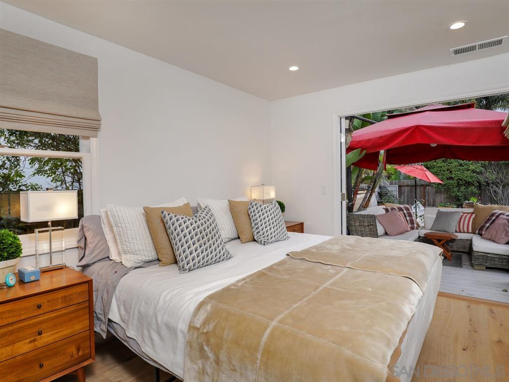 253 26th Street Del Mar, CA 92014 - Photo 13 of 21 a bedroom with a bed and large window