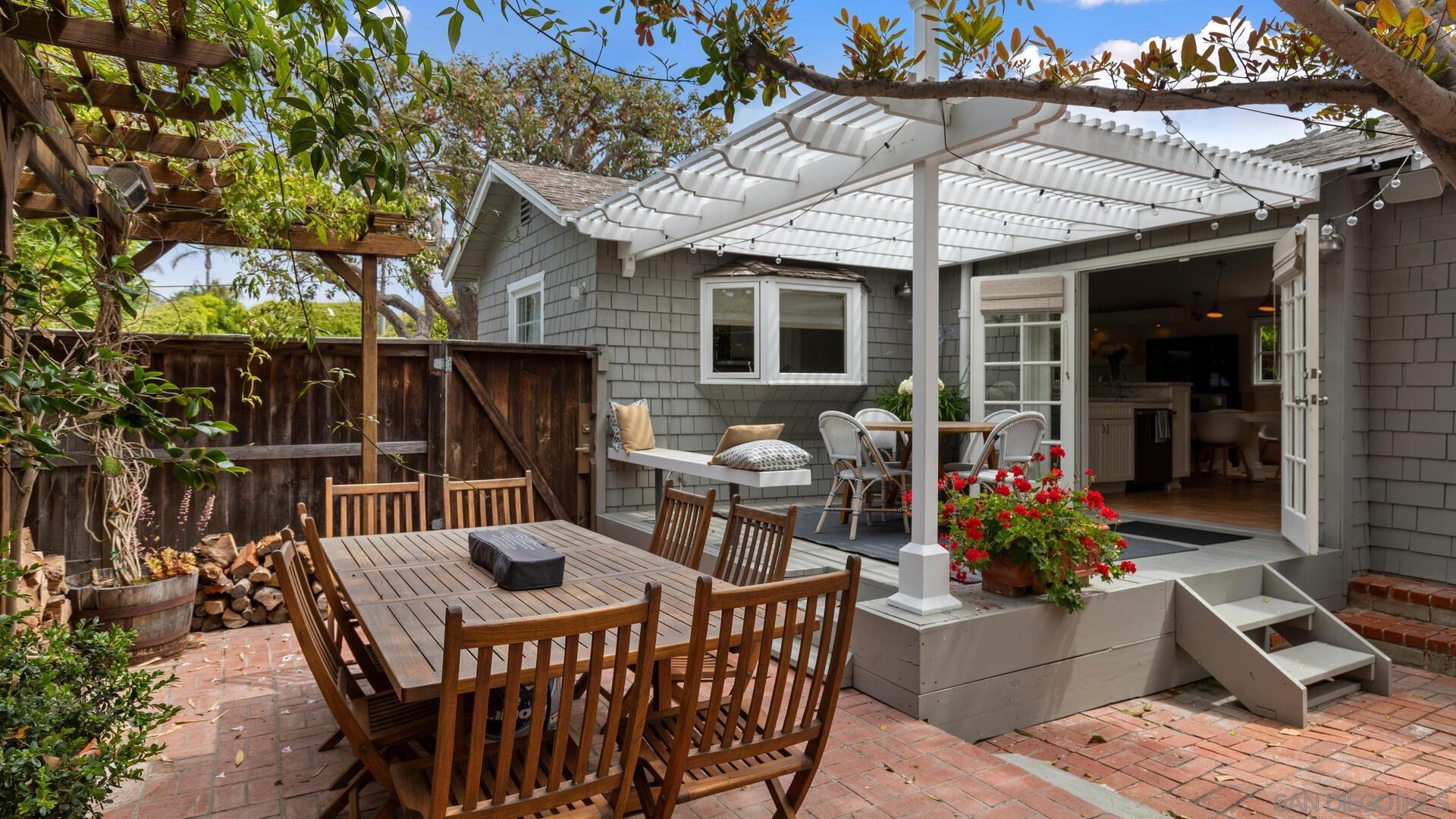 253 26th Street Del Mar, CA 92014 - Photo 18 of 21 a table and chairs in front of the house