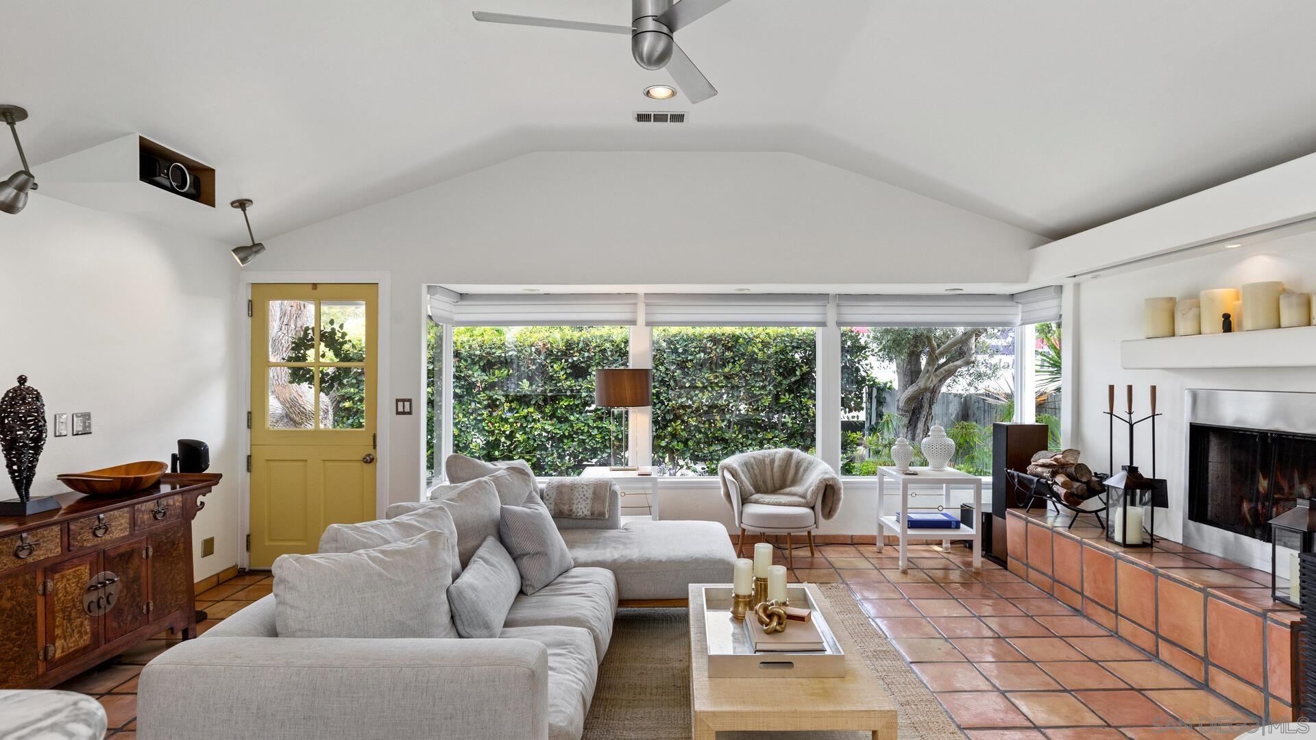 253 26th Street Del Mar, CA 92014 - Photo 20 of 21 a living room with furniture a fireplace and a flat screen tv