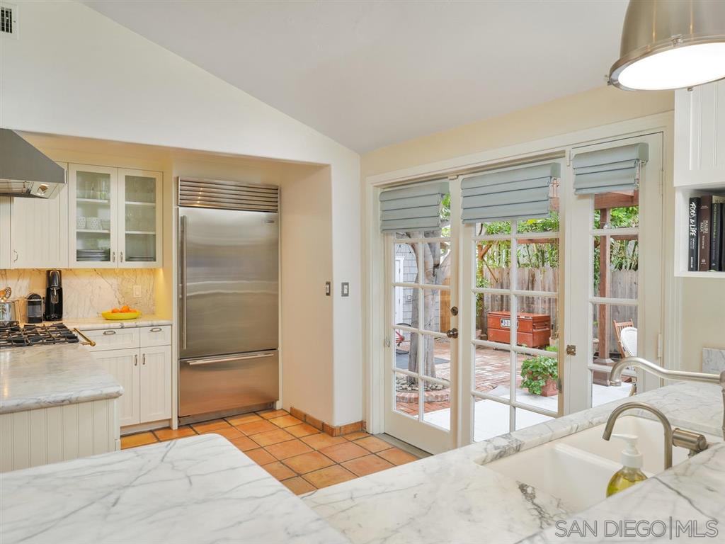 253 26th Street Del Mar, CA 92014 - Photo 3 of 21 a bedroom with a bed and a flat screen tv