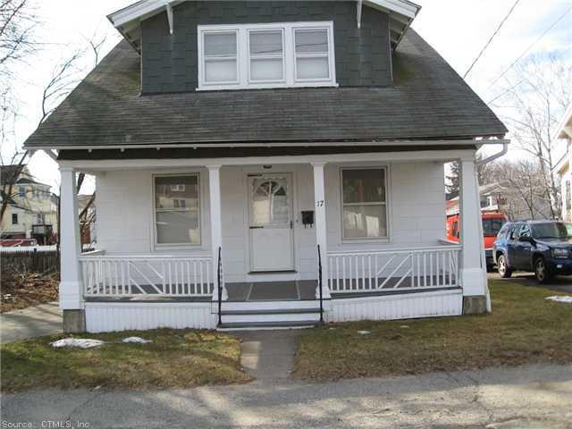a view of a house with a yard and fence