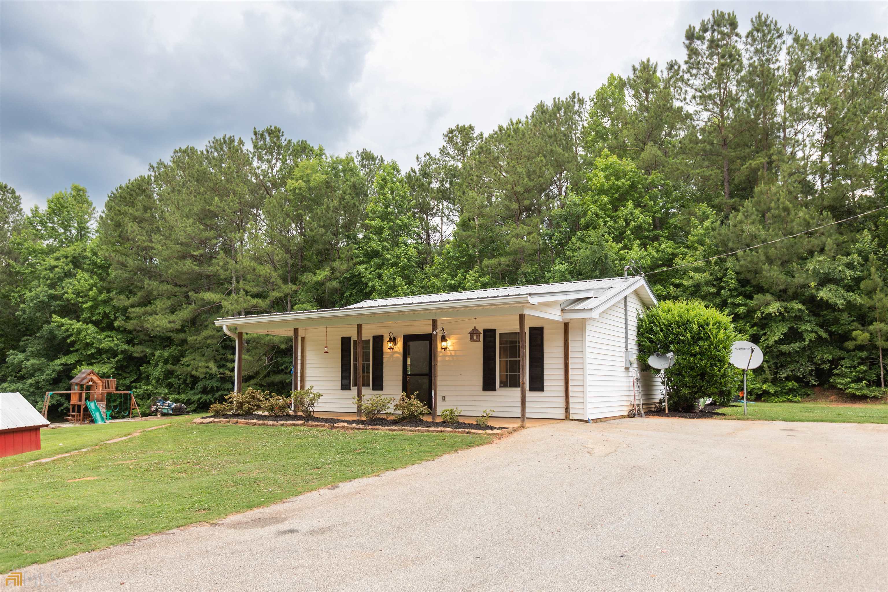2291 Newborn Road Rutledge, GA 30663 - Photo 1 of 1 front view of a house with a patio