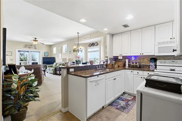 a kitchen with lots of counter top space and a sink