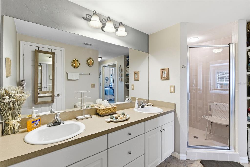 502 Main Street, Unit 112 Horseshoe Beach, FL 32648 - Photo 22 of 45 a bathroom with a granite countertop sink and a mirror